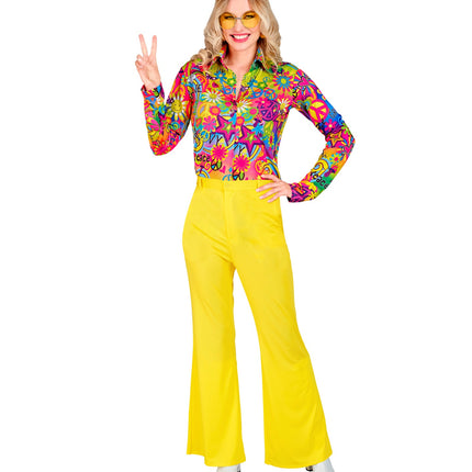 Gele jaren 70 broek dames gedragen - hippie discobroek flower power sixties