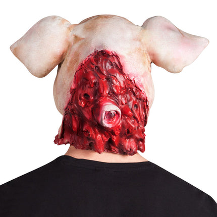 Achterzijde van het latex varkensmasker met rood vleesreliëf en een uitstekend oog