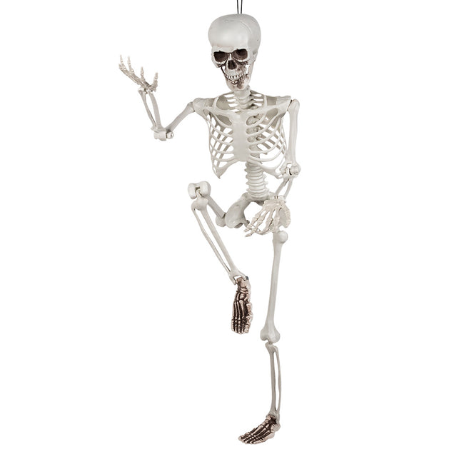 Beweegbaar skelet met opgetrokken knie en geheven arm in een dansende pose
