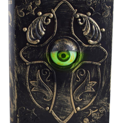 Boek met boze oog met groen oog achter gewelfde lens, decoratie voor Halloween