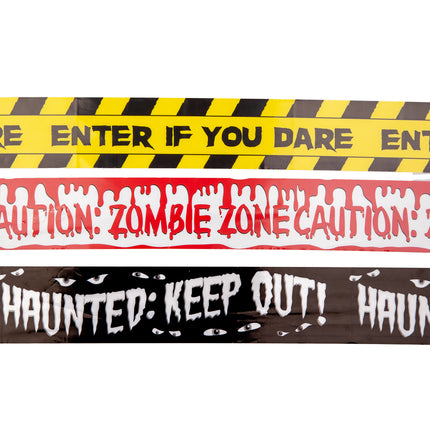 Detail van zwart caution tape met witte druipletters en loerende ogen voor een griezelhoek