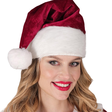 Kerstmuts Santa December op het hoofd van een dame, witte rand tot boven de wenkbrauwen