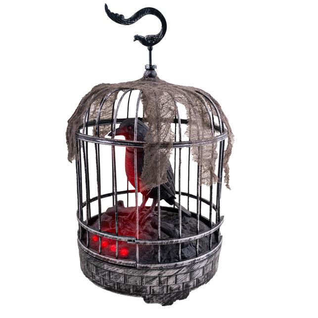 Kraai in kooi van 32 cm, zwart-grijze vogelkooi met rood oplichtende kraai en flarden gaas voor Halloween