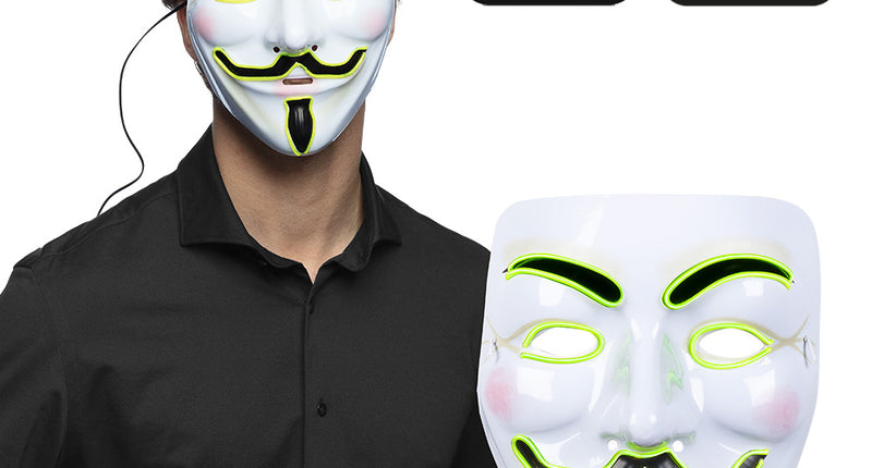 LED masker Protest wit met neongele lichtdraad en zwarte snor, gedragen met batterijhouder in de hand