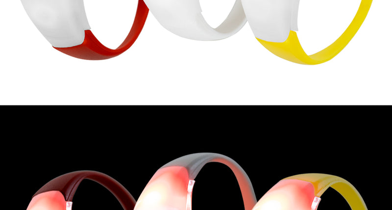 Lichtgevende armbanden in rood, wit en geel met witte lichtkap, boven uit en onder oplichtend