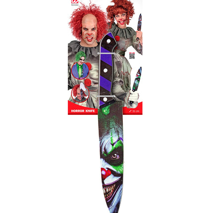 Mes kwaadaardige clown Guus van 31 cm op verpakking, heft zwart met paarse blokken