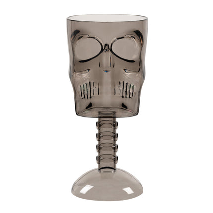 Plastic kelk Smoke skull in rookgrijs doorschijnend plastic, met doodskop, wervelsteel en ronde voet, voor Halloween