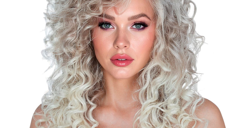 Pruik supercurls dames met volle blonde krullen tot over de schouders, voor een jaren 80-feest