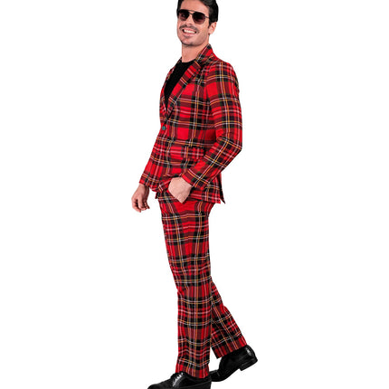 Schotse ruit suit van de zijkant, met zakken in de broek en revers op het colbert