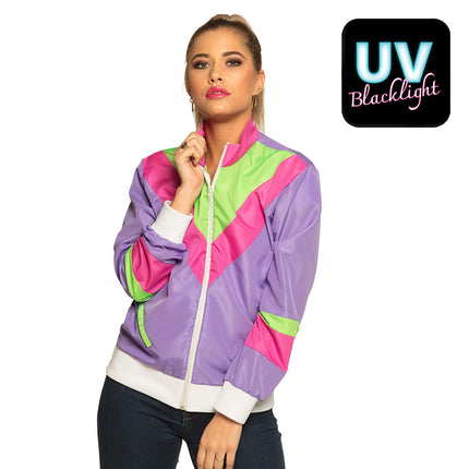 Trainingsjasje Retro babe paars met neonroze en groene vlakken, gedragen door dame op jaren 80-feest